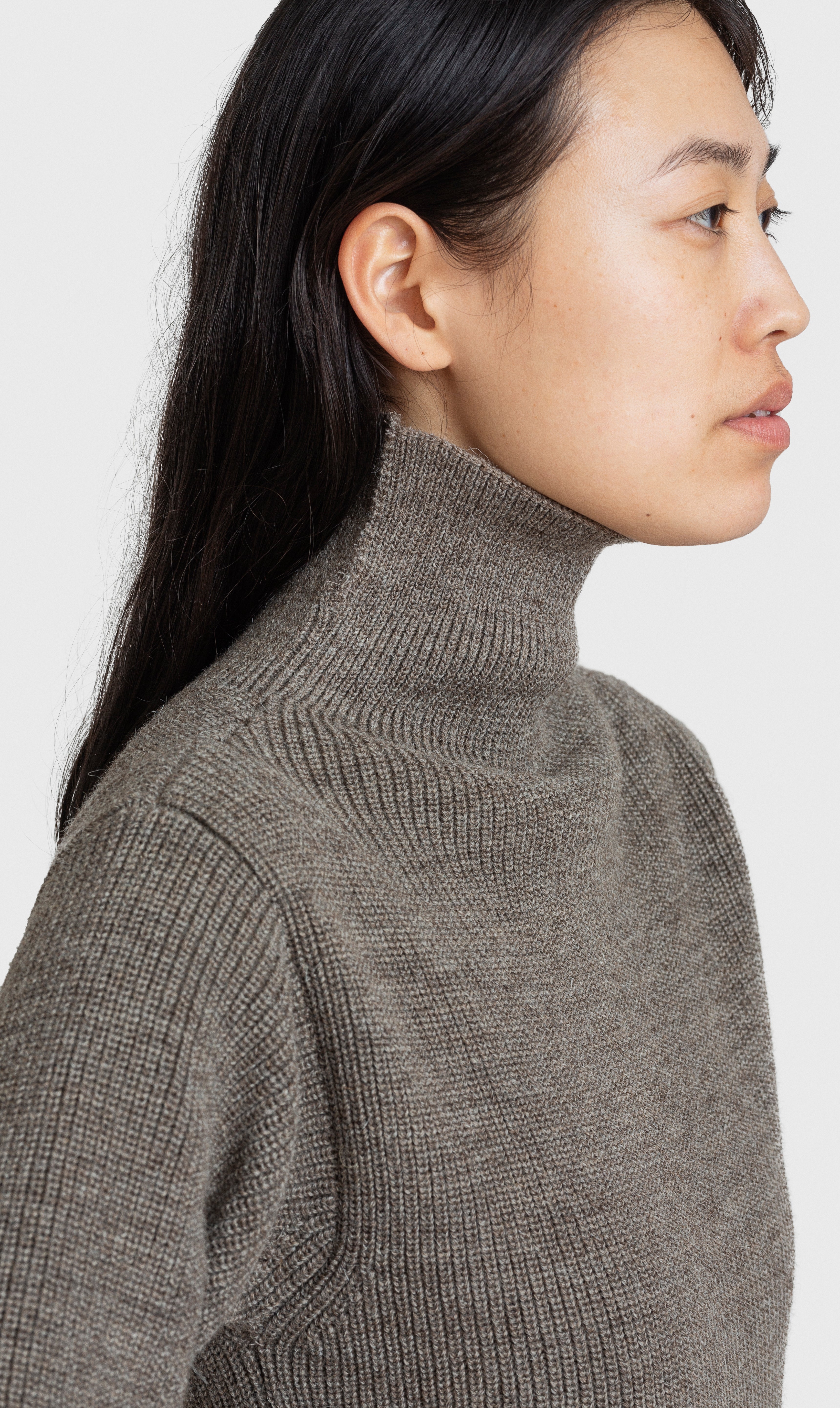 Sarah wearing Sailor Turtleneck in Natural Taupe